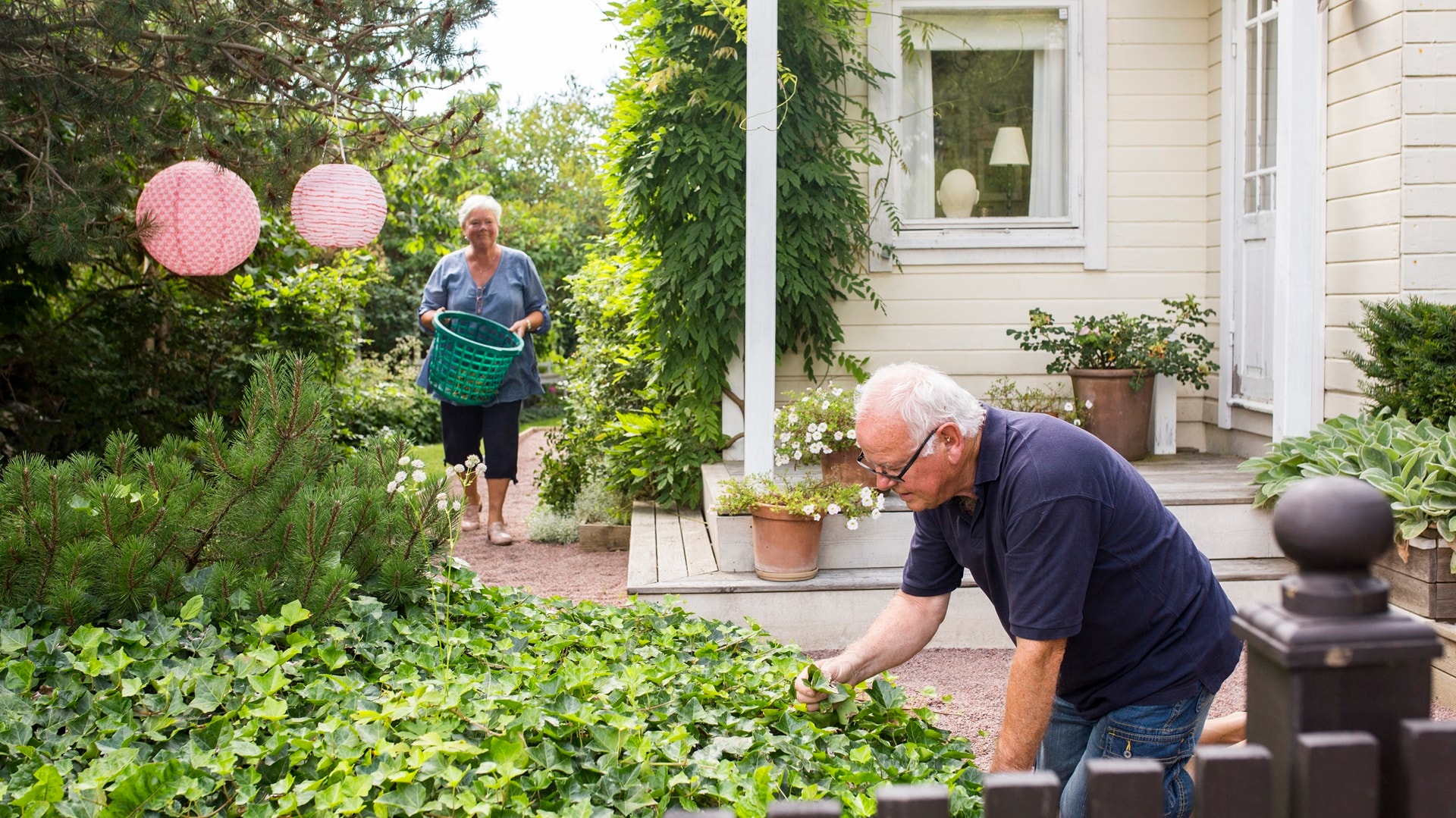 senior-man-and-woman-working-in-garden